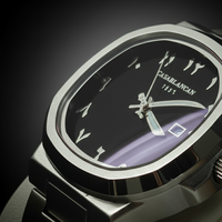 Casablancan watch with black face and silver case on a dark background