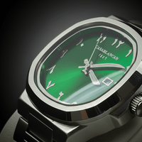 Green watch face with silver casing on a dark background