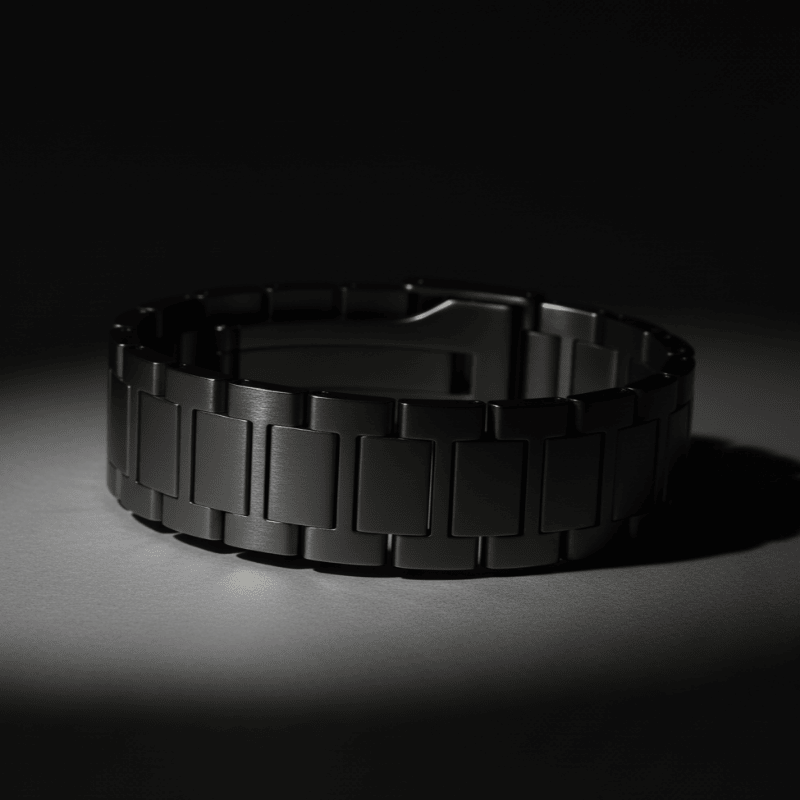 Silver metal Arabic dial watch strap on a dark background
