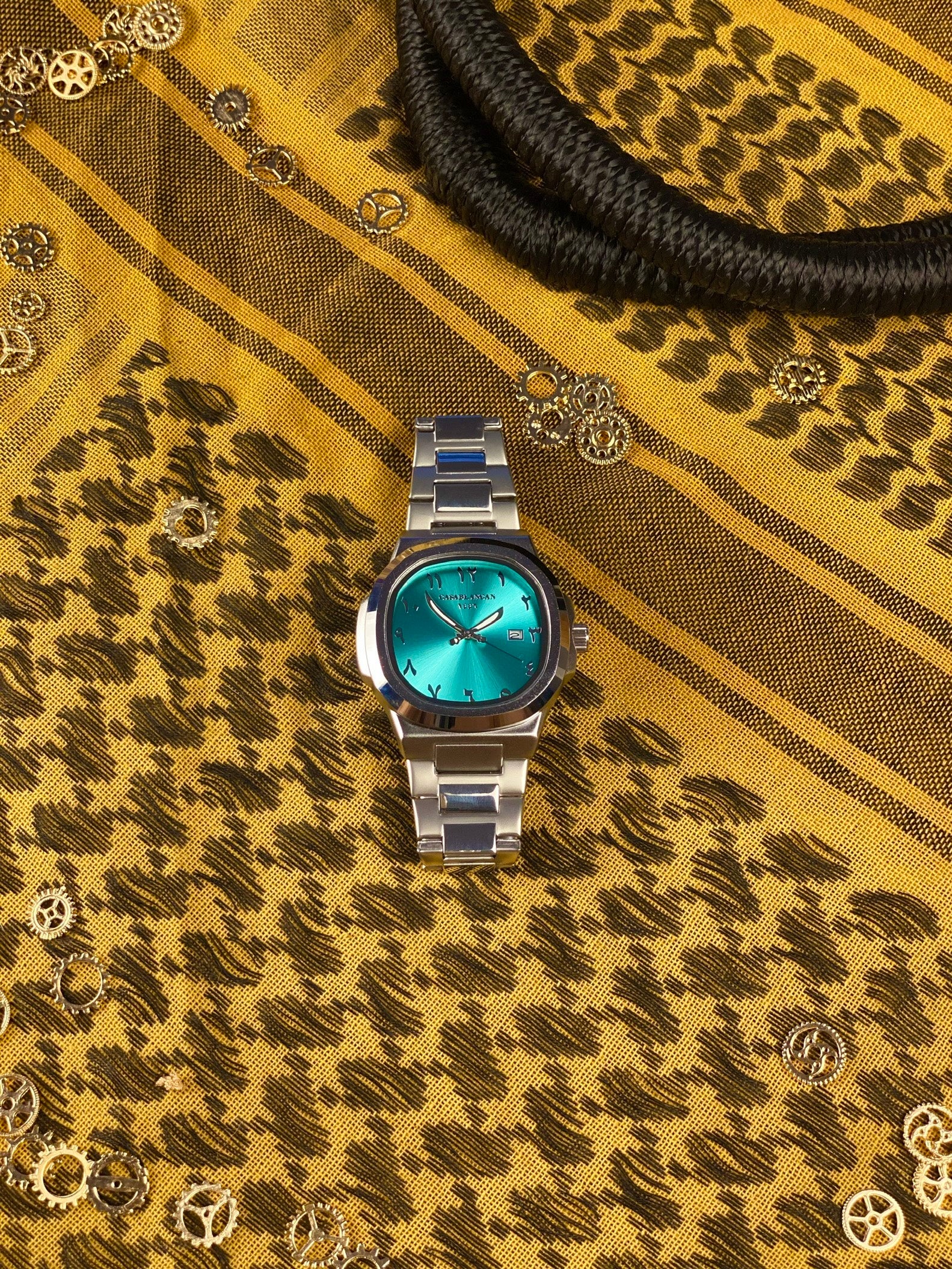 Casablancan Al-Majaz heritage Arabic dial 43mm Watch on a patterned fabric background