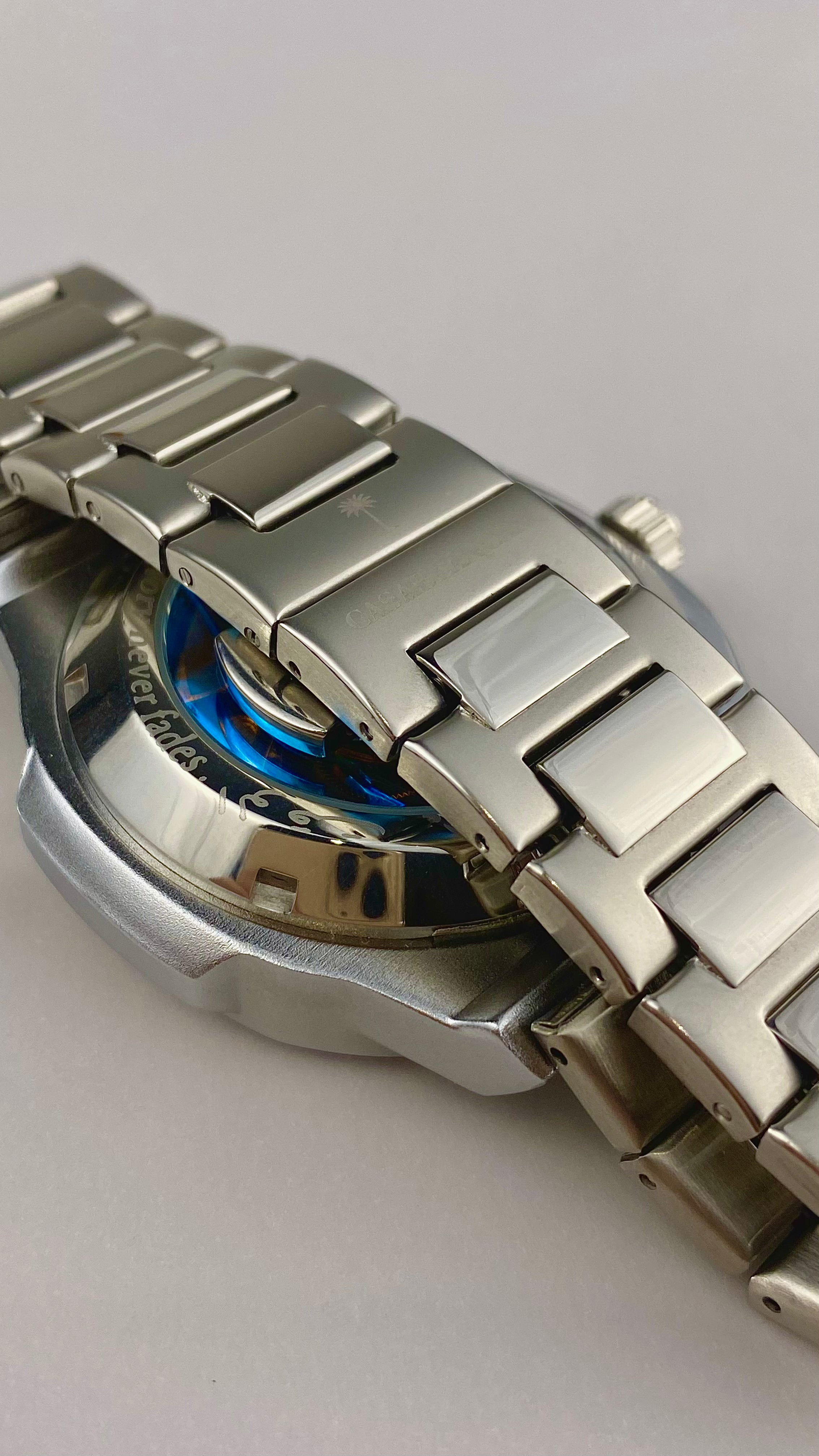 Casablancan Arabic numerals watch band with logo backshot  on a light gray background