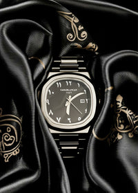Luxury Casablancan Onyx Sentinel Arabic dial 43mm Watch intricate design on a black fabric background