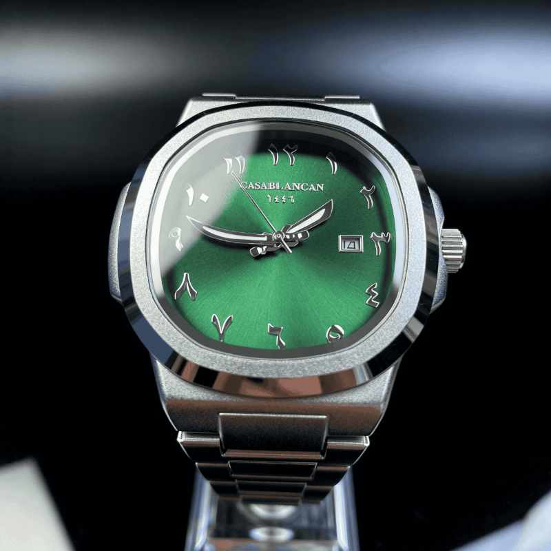 Casablancan Arabic Dial Silver watch with a green face on a blurred background