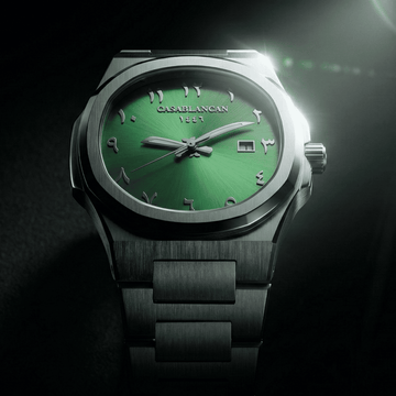 Casablancan Green Arabic dial watch with metallic band on a dark background